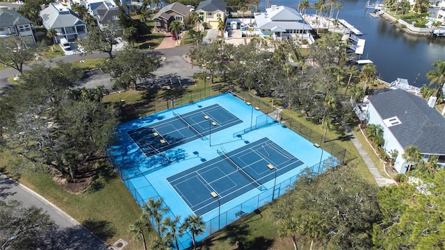 birds eye view of property with a water view