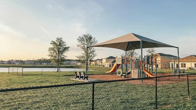 view of play area with a water view and a lawn