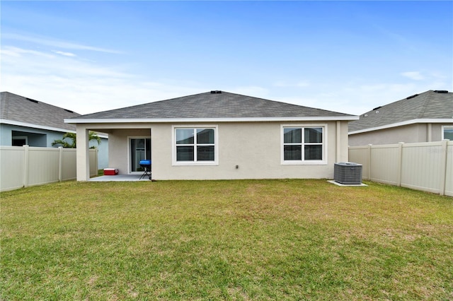 back of property featuring a patio area, central AC unit, and a yard