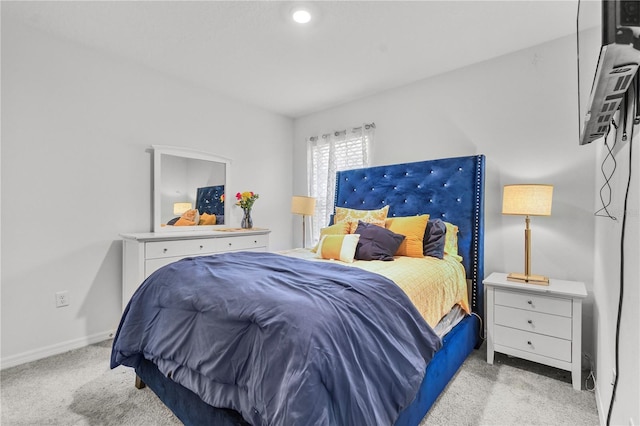 bedroom featuring light carpet