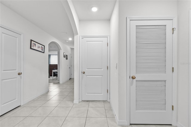 hallway with light tile patterned flooring