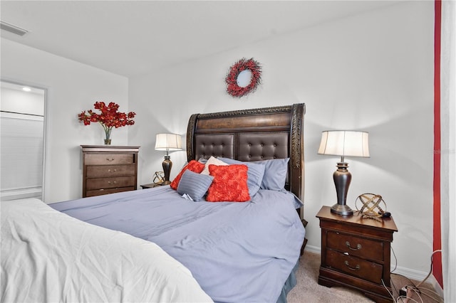 bedroom with light colored carpet