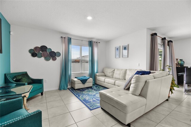 tiled living room with a textured ceiling