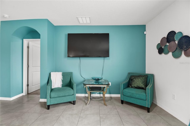 sitting room with tile patterned flooring