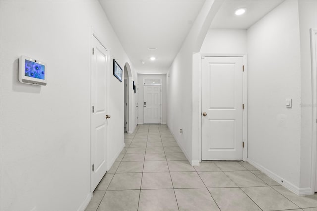 hallway with light tile patterned floors