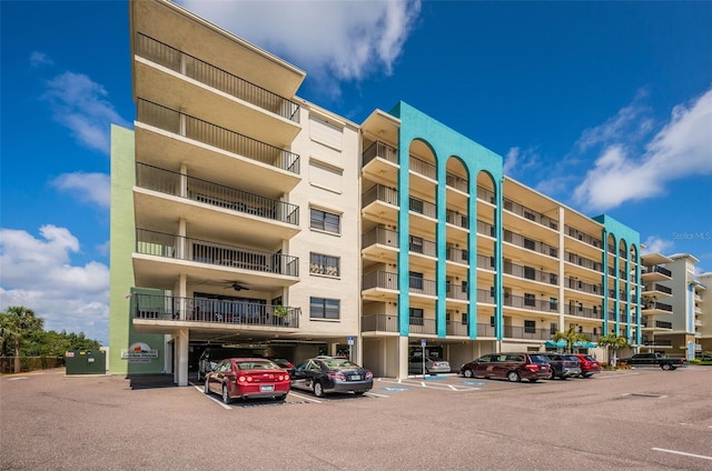 view of property featuring uncovered parking