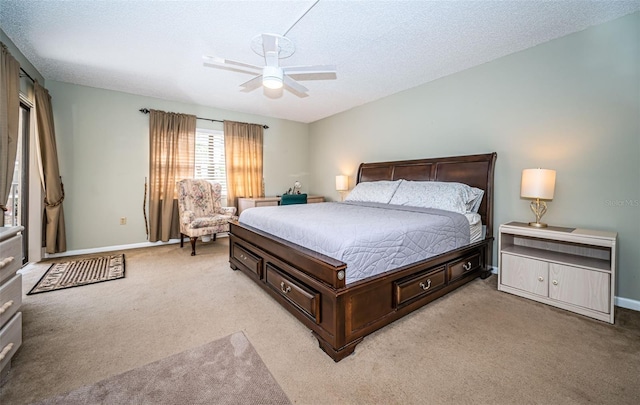 bedroom with baseboards, light carpet, a textured ceiling, and ceiling fan