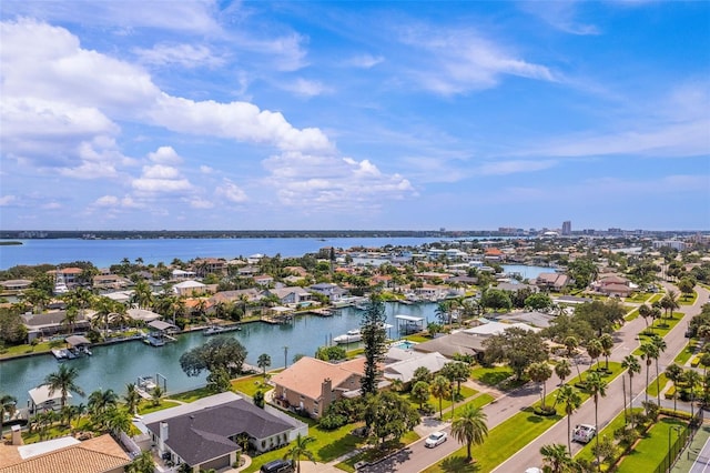 drone / aerial view featuring a residential view and a water view