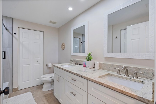 full bathroom with toilet, visible vents, a closet, and a sink