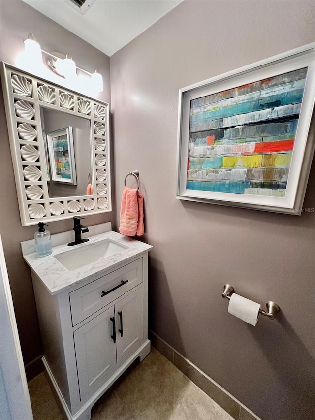 bathroom with vanity and baseboards