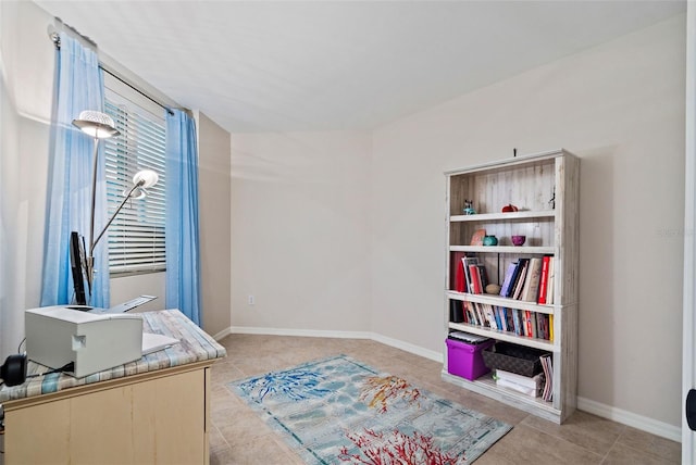 office featuring light tile patterned floors and baseboards