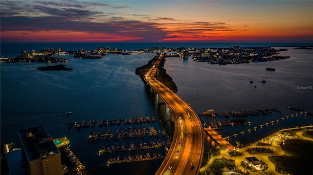 aerial view at dusk with a water view