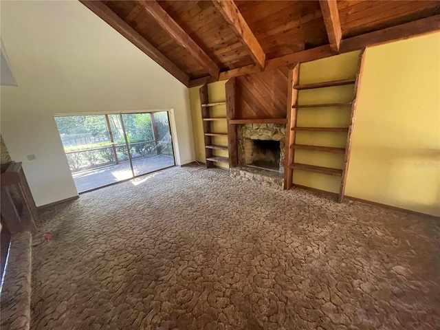 unfurnished living room featuring built in features, a stone fireplace, wooden ceiling, and beam ceiling