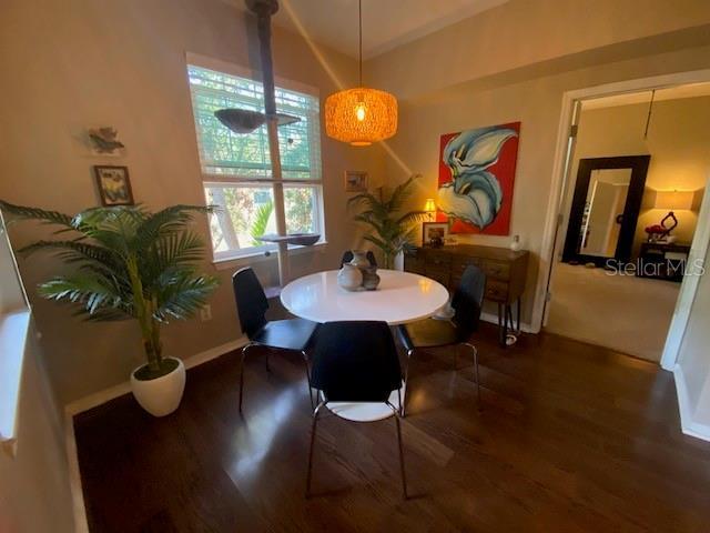 dining space featuring dark hardwood / wood-style floors