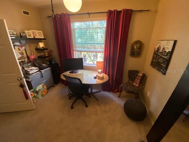 home office with carpet floors