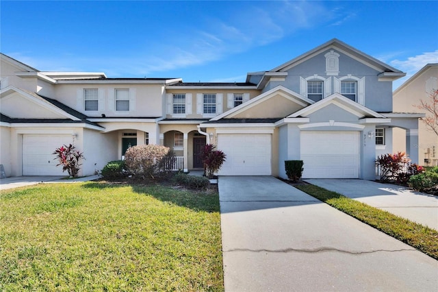 view of front property with a front lawn and a garage