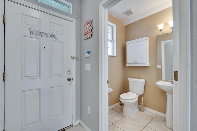 bathroom with sink, tile patterned floors, and toilet