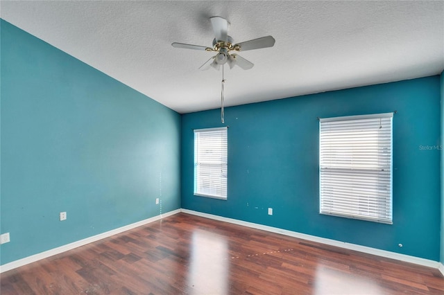 spare room featuring hardwood / wood-style floors, a textured ceiling, and ceiling fan