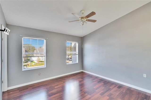 unfurnished room with ceiling fan and dark hardwood / wood-style floors