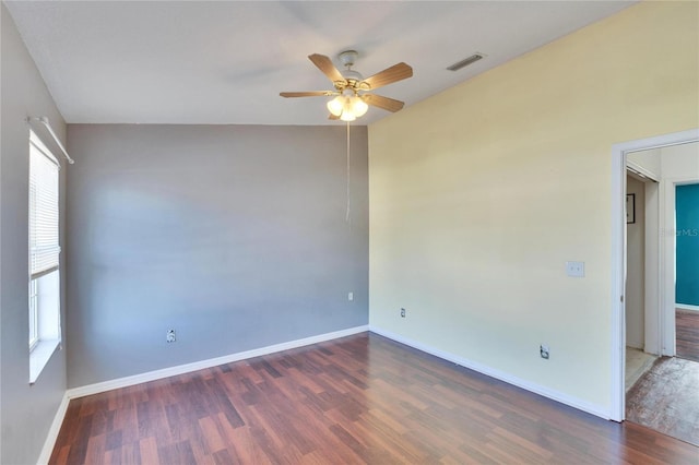 unfurnished room featuring ceiling fan and dark hardwood / wood-style floors