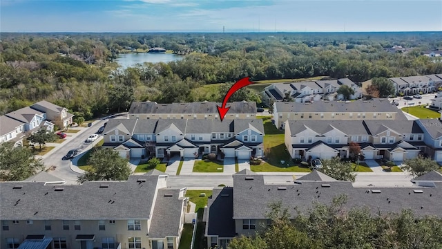 birds eye view of property with a water view