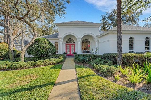 view of front facade with french doors and a front yard