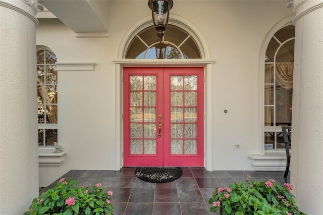 view of exterior entry featuring french doors