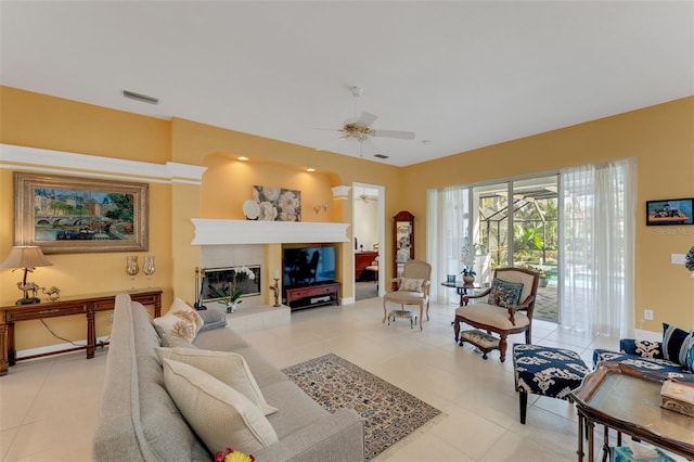 living room featuring ceiling fan and light tile patterned floors