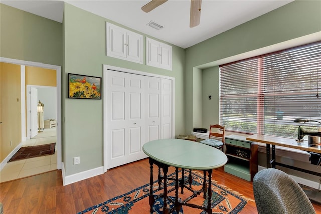 dining space featuring hardwood / wood-style flooring and ceiling fan