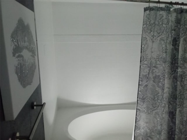 bathroom featuring a shower with curtain