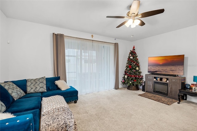 carpeted living room featuring ceiling fan