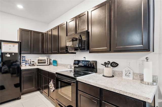 kitchen with light tile patterned floors, dark brown cabinets, and black appliances