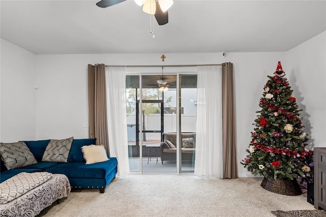 living room featuring light colored carpet and ceiling fan