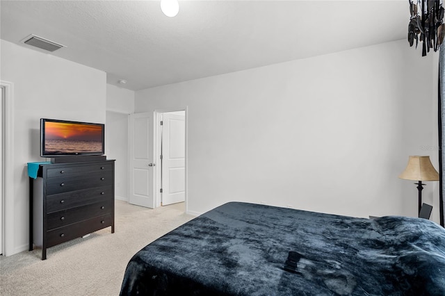 carpeted bedroom with a textured ceiling