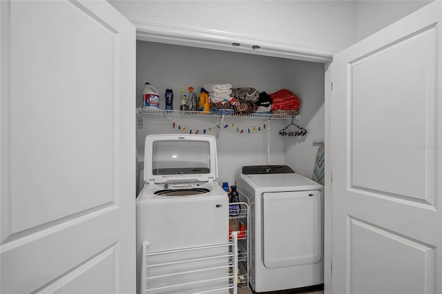 laundry area with washing machine and dryer