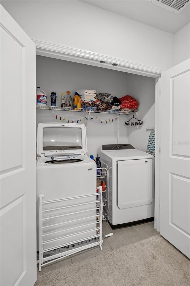 clothes washing area featuring washing machine and dryer