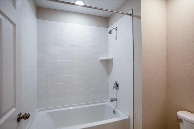 bathroom featuring toilet and tub / shower combination