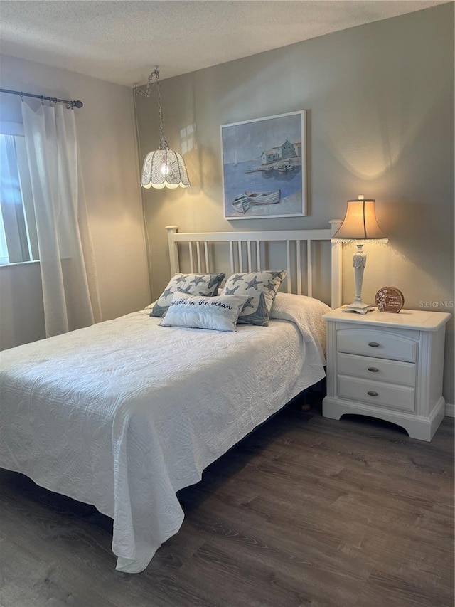 bedroom featuring dark hardwood / wood-style floors