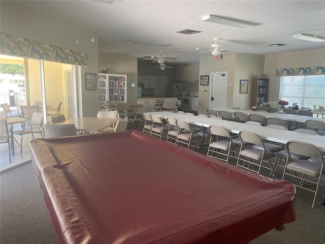 game room with ceiling fan, plenty of natural light, a textured ceiling, and pool table