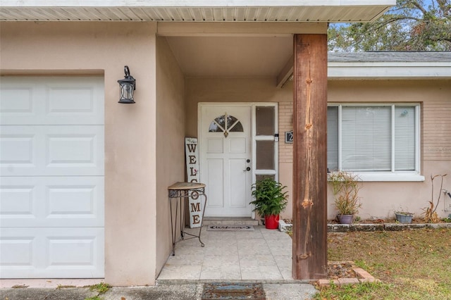 doorway to property featuring a garage