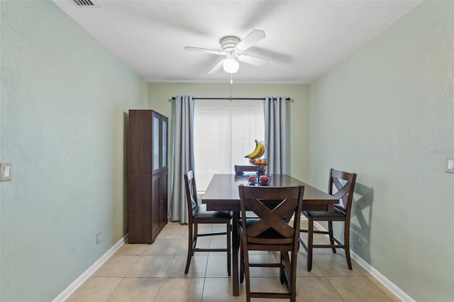 dining room featuring light tile patterned floors and ceiling fan