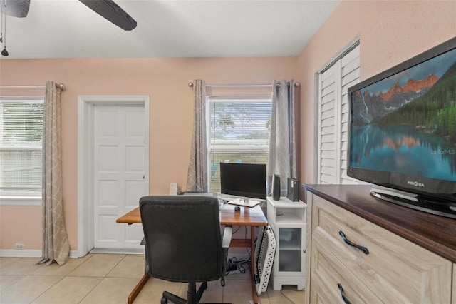 home office with light tile patterned flooring and ceiling fan