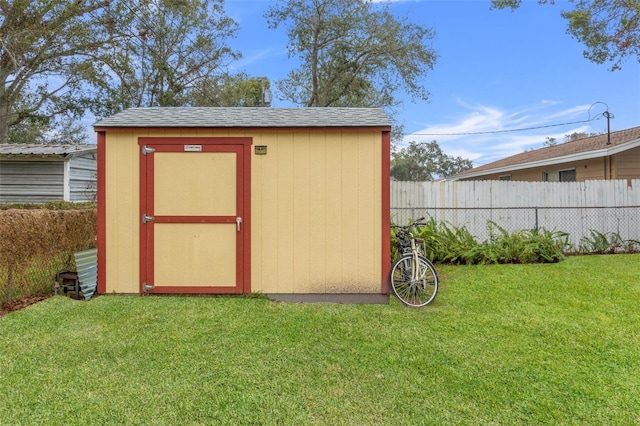 view of outdoor structure with a yard