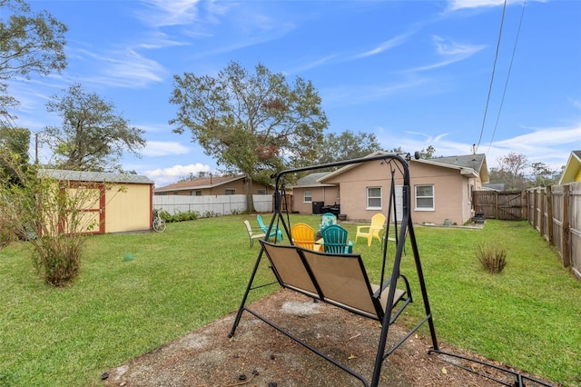 view of yard with a storage unit