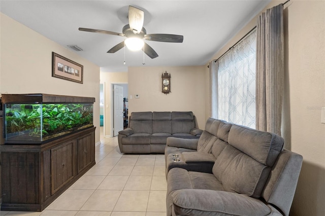 living room featuring ceiling fan and light tile patterned floors