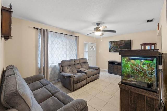 tiled living room featuring ceiling fan