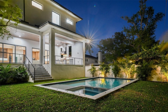 5038 W Dickens Ave, Tampa, FL 33629 - back of house at twilight with an in-ground hot tub and stucco siding