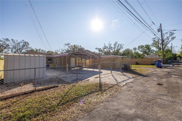 rear view of property with a carport