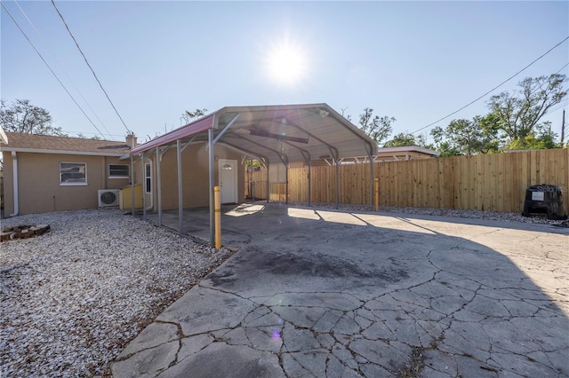 view of patio / terrace with ac unit and a carport