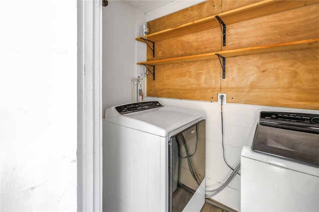 laundry area featuring washing machine and clothes dryer